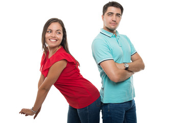 Fototapeta premium Couple standing back to back being playful
