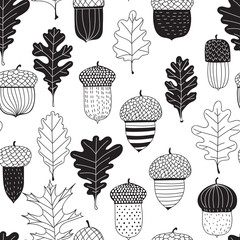 Seamless pattern made of doodled acorns and oak leaves.