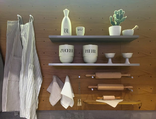 Kitchen utensils on shelf and wall