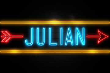 Julian  - fluorescent Neon Sign on brickwall Front view - obrazy, fototapety, plakaty