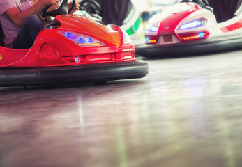 Obraz na płótnie Canvas Colorful electric bumper car in autodrom in the fairground attractions at amusement park