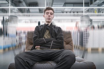 surround sound, young man on a leather armchair