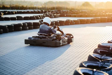 Fototapeten Karting competition or racing cars riding for victory on a racetrack © 4Max