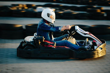 Karting competition or racing cars riding for victory on a racetrack