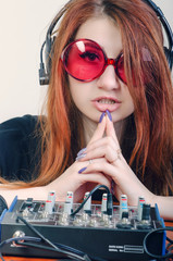 Girl behind the music console © skilas