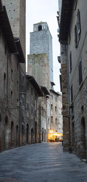 Fototapeta morning panorama in Italian city with street cafe