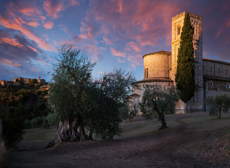 Stunning Sunrise between Village and Abbey - Sant'Antimo Abbey, Castelnuovo dell Abate, Montalcino, Tuscany, Italy, Europe.