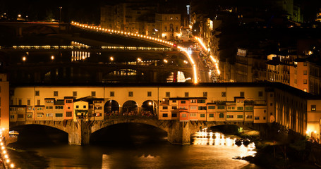 Ponte Vecchio by Night - Piazzale Michelangelo, Florence, Tuscany, Italy, Europe The oldest bridge of the Town keeps watching the River running underneath nicely highlighted by the City lights.