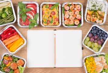 Planning a diet, healthy meals and salads in boxes on wooden table, top view