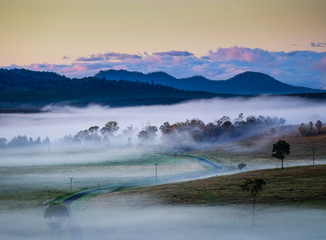 View of fog over the hills at dawn in the Grandchester area of Ipswich and the Scenic Rim