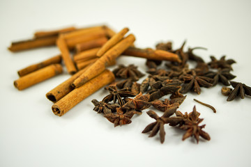 Star anise and cinnamon on white background
