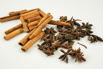 Star anise and cinnamon on white background
