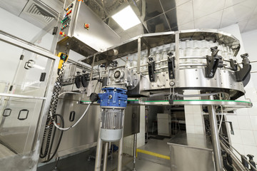 Empty glass bottles on the conveyor.