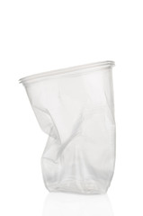 Crumpled plastic cup on white background