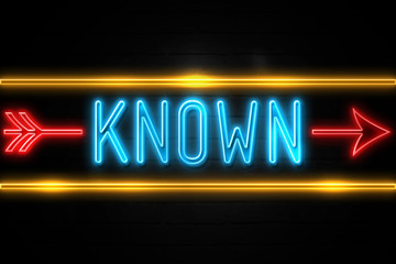 Known  - fluorescent Neon Sign on brickwall Front view