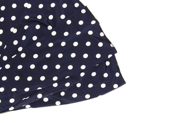 Draped blue silk with polka dots as a background