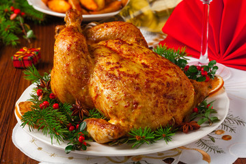 Roasted whole chicken with Christmas decoration.
