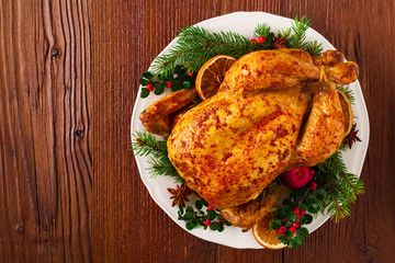 Roasted whole chicken with Christmas decoration.