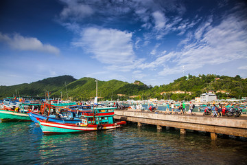 Fototapeta na wymiar traditional colorful Vietnamese fishing boats in the main port of Nam Du Islands, Kien Giang, Vietnam. Nam Du has become a popular tourist attraction, but foreigner are only allowed in with a permit.