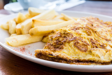 omelet with ham tomato and French fries