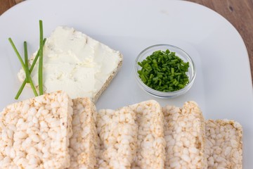 Rice cakes with cream cheese and chives