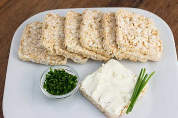 Rice cakes with cream cheese and chives