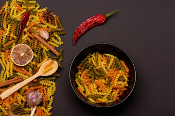 delicious colorful italian pasta with different ingredients for cooking