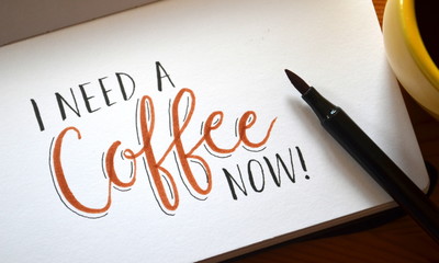 I NEED A COFFEE NOW hand lettered in notebook - Powered by Adobe