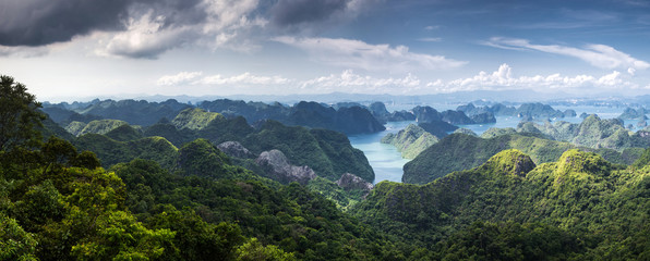 scenic view over Ha Long bay from Cat Ba island, Ha Long city in the background, UNESCO world...