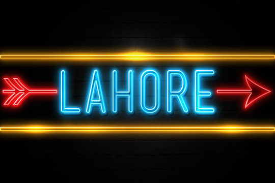 Lahore  - fluorescent Neon Sign on brickwall Front view