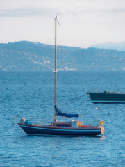 Several sailboats are anchored for the coast of Saint Tropez.