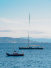 Fototapeta premium Several sailboats are anchored for the coast of Saint Tropez.