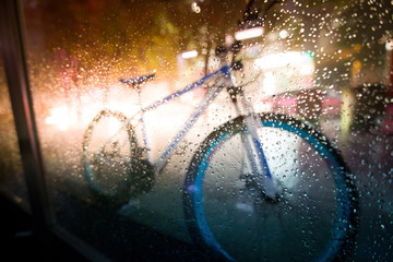 Detail of a Vintage Bicycle Handlebar Resting in the Narrow Street (vintage color toned image)