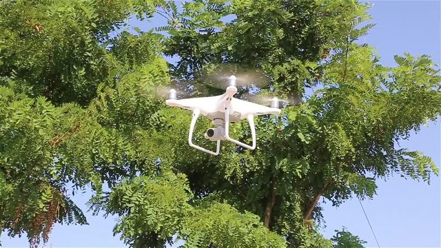 Quadcopter drone flying, technology and surveillance concepts