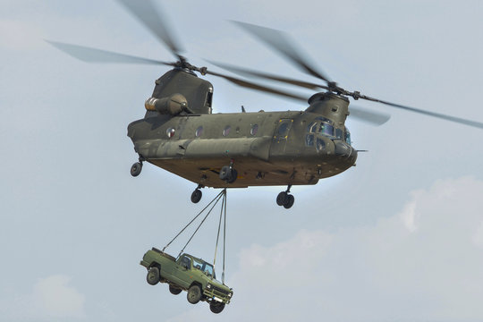 Chinook helicopter carrying a jeep
