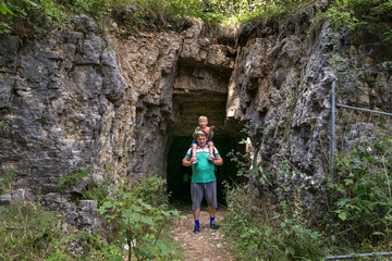 Fototapeta premium a man carries a boy on his shoulders.