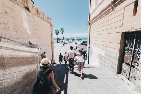 Tourists walking in the capital of Sardinia