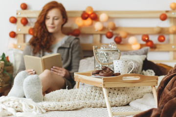 Woman reading in bed