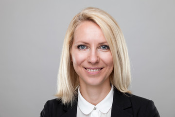 Headshot of young and happy business woman