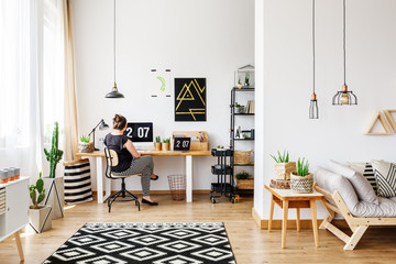 Girl in wooden white loft