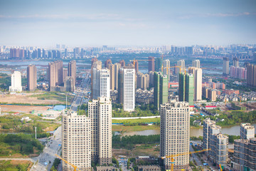 Fototapeta premium Aerial view of city buildings and river, China Nanchang