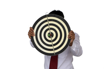 Businessman holding a dart board