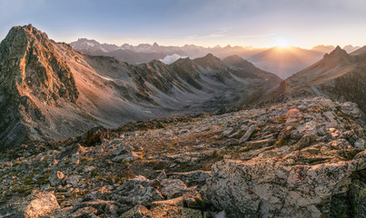 large mountain gorge, with stones from the mountain in the evening at sunset