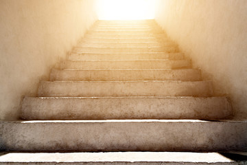 Fototapeta na wymiar stairs leading up to the sunlight
