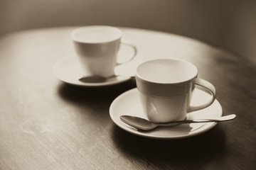 two cup of coffee on wood table meeting concept vintage color tone