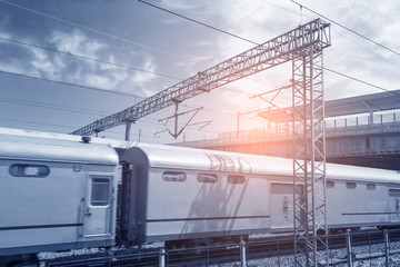 Modern high speed train at the railway station with motion blur effect