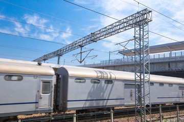Fototapeta na wymiar Modern high speed train at the railway station with motion blur effect