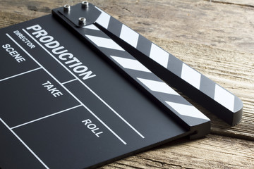 movie clapper on wooden background