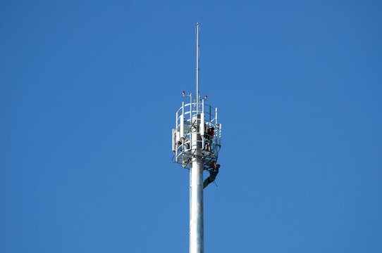 workers on a telecommunication tower