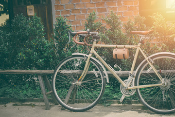 Fototapeta na wymiar hipster road bike leather seat old style parking vintage color tone